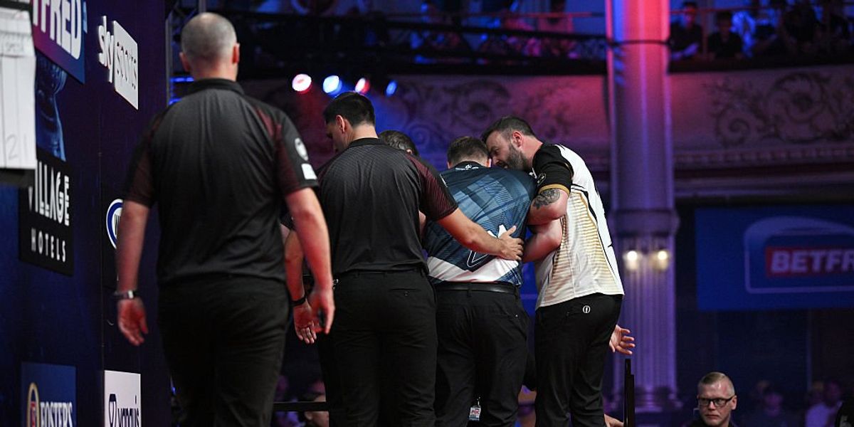 Cameron Menzies: Darting star forced off stage after being taken ill while playing