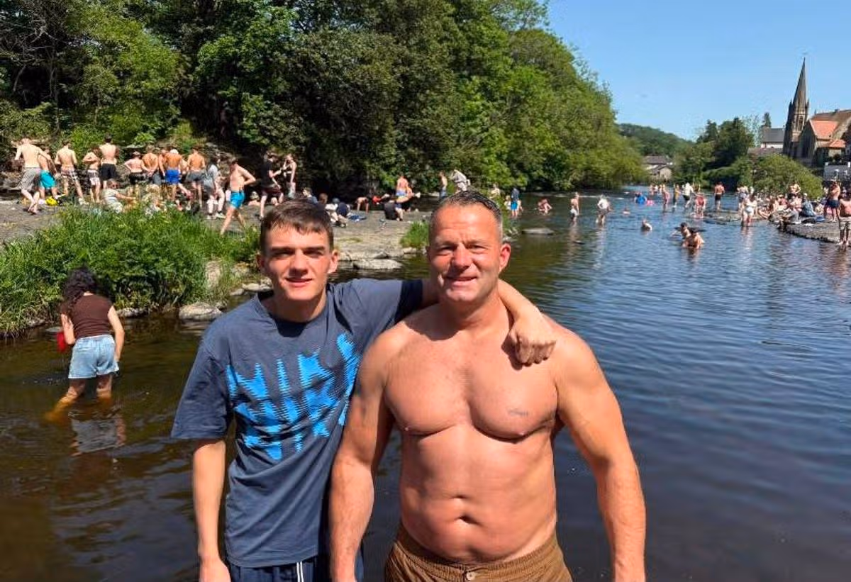 Andrew Tinsley, 46, with his son