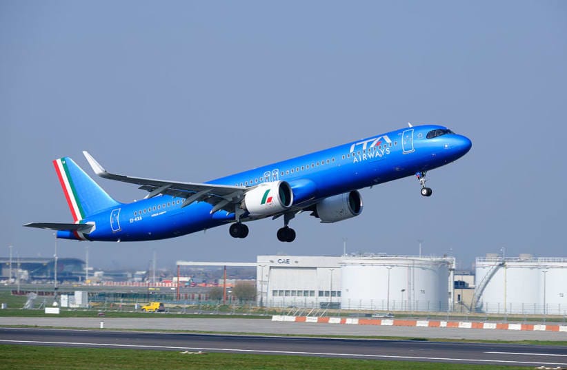 An Airbus A321-271NX (EI-HXA) from ITA Airways takes off as it passes in front of kerosene tanks on March 21, 2026, in Brussels-Zaventem Airport, Belgium.