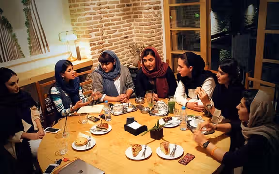 Women gather at a café in Tehran. Cafés have become important social spaces for young Iranians, but several venues in the capital were recently closed. (File photo)