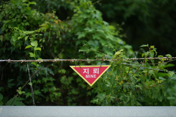 A sign indicating land mines is seen near the civilian control line in Cheorwon, South Korea, Thursday, July 16, 2026. (AP Photo/Lee Jin-man)