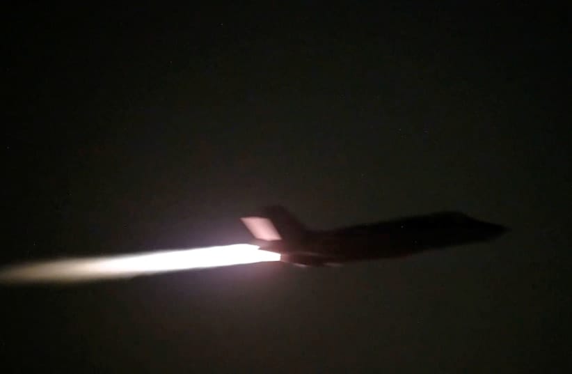A US military aircraft flies at an unknown location, during what U.S. Central Command (CENTCOM) says are strikes on Iran, in this screengrab taken from a handout video released on July 20, 2026. 