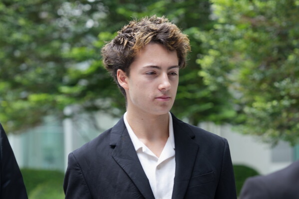 Didier Gaspard Owen Maximilien arrives at the State Courts building in Singapore, Monday, July 13, 2026. (AP Photo/David Hu)