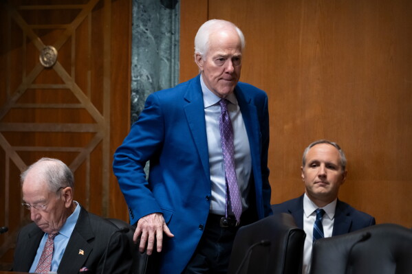 Sen. John Cornyn, R-Texas, arrives for a hearing of the Senate Finance Committee on Capitol Hill, Thursday, July 30, 2026, in Washington. (AP Photo/Mark Schiefelbein)
