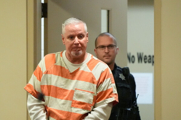 Colin Gray, the father of Apalachee High School shooting suspect Colt Gray, arrives to the courtroom at the Barrow County courthouse, Dec. 18, 2025, in Winder, Ga. (AP Photo/Brynn Anderson, File)