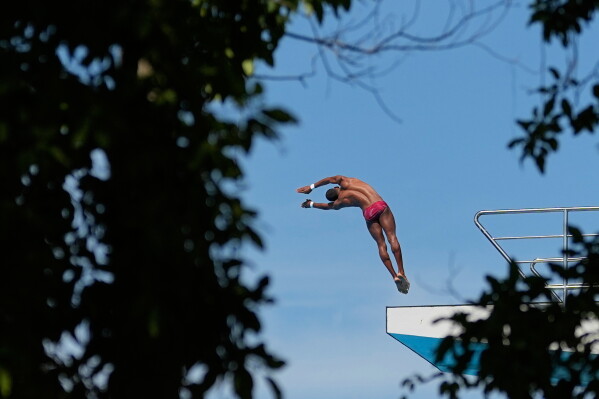 Dominican Republic's Symbol Sanchez competes in the men's platform preliminary diving event at the Central American and Caribbean Games in Santo Domingo, Dominican Republic, Wednesday, July 29, 2026. (AP Photo/Fernando Vergara)