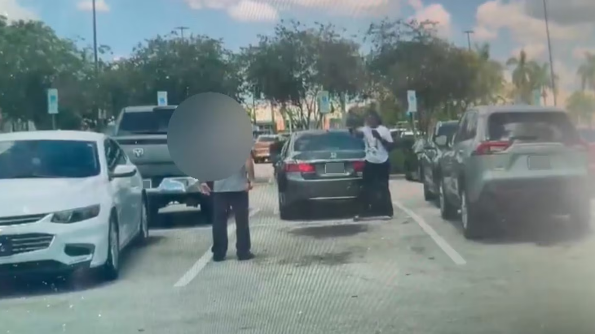 A still from a video of a deadly shooting in the parking lot of a Walmart in North Lauderdale, Florida, June 30, 2026.