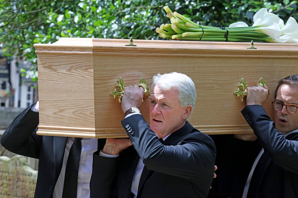 Mark Hughes carries coffin at son Alex's funeral