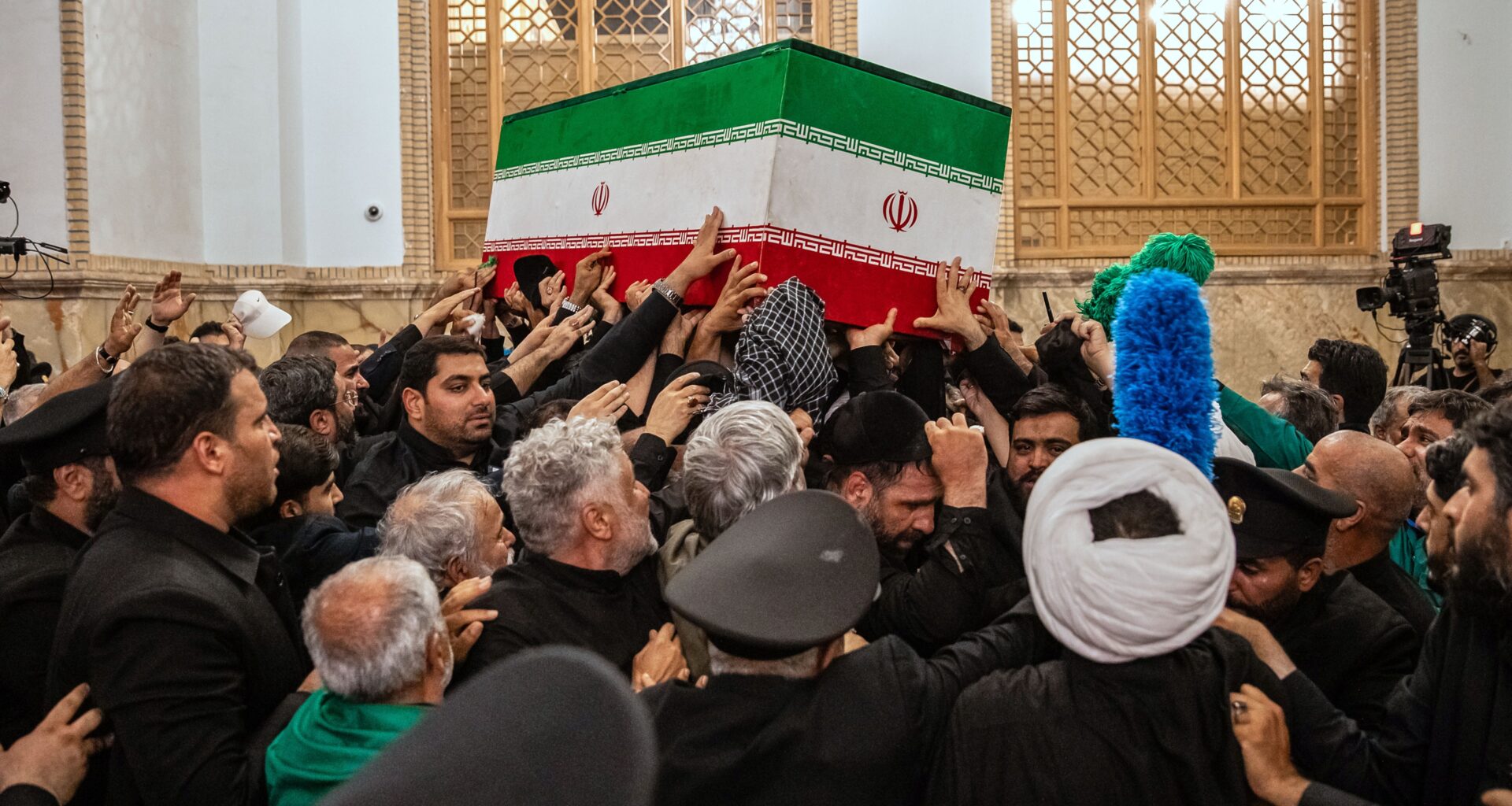 In this photo released by Iran's Supreme Leader's office, mourners carry the coffin of the late Iranian Supreme Leader Ayatollah Ali Khamenei above the crowd for the final prayer before his burial at the Imam Reza Shrine in Mashhad, northeastern Iran, Thursday, July 9, 2026. (Office of the Iranian Supreme Leader via AP)