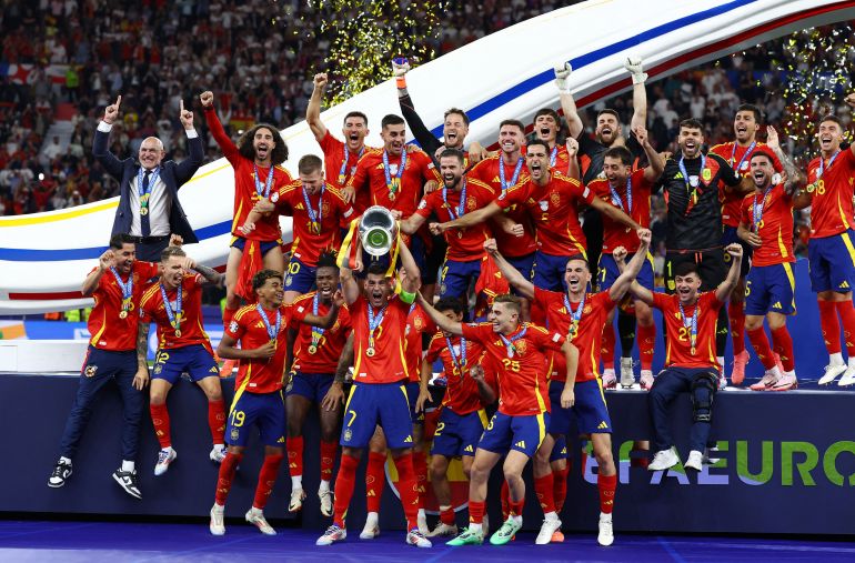 Spain's Alvaro Morata lifts the trophy as they celebrate after victory in Euro 2024