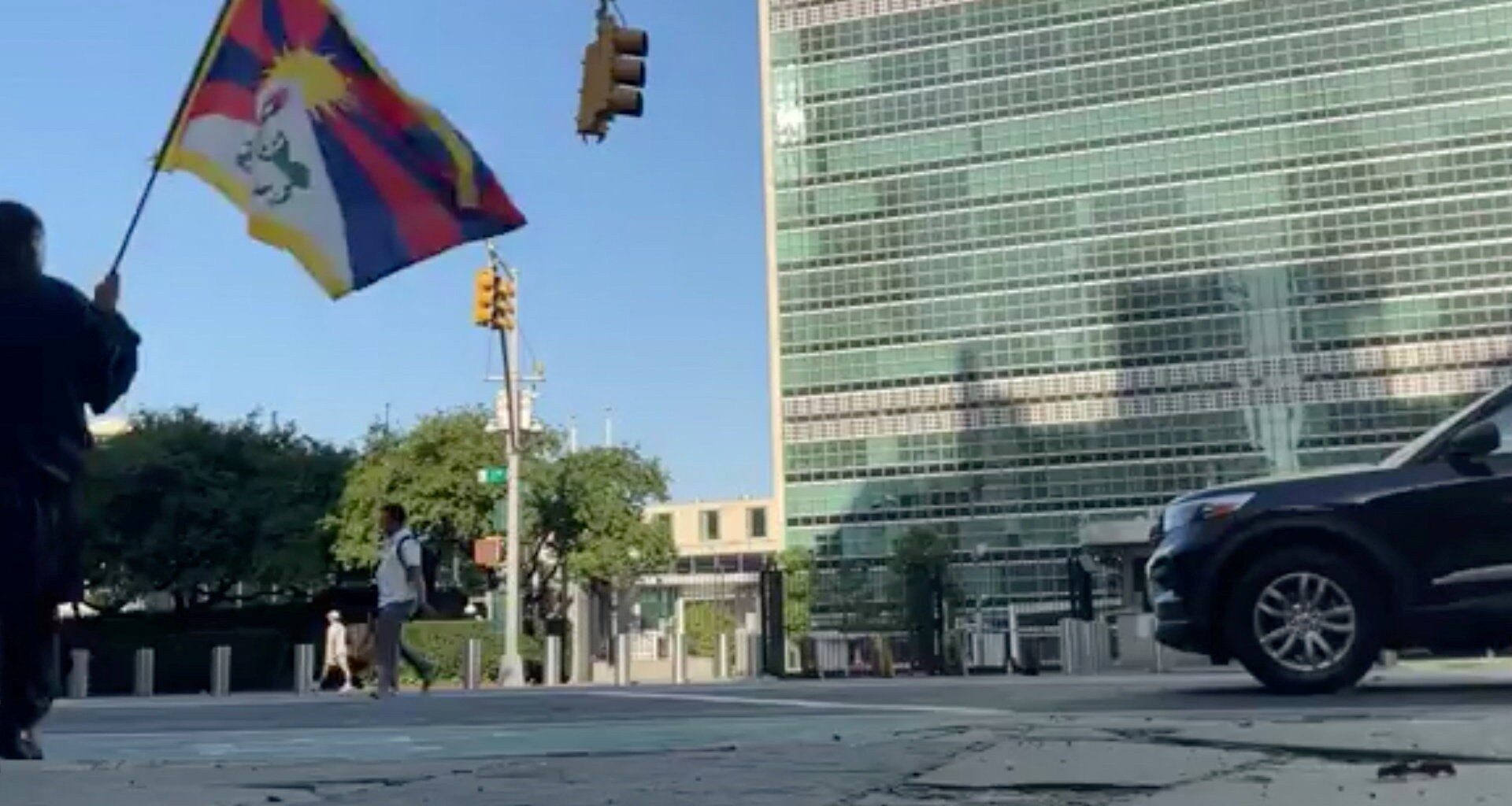 Man holding Tibetan flag dies after setting himself on fire outside UN | Politics News