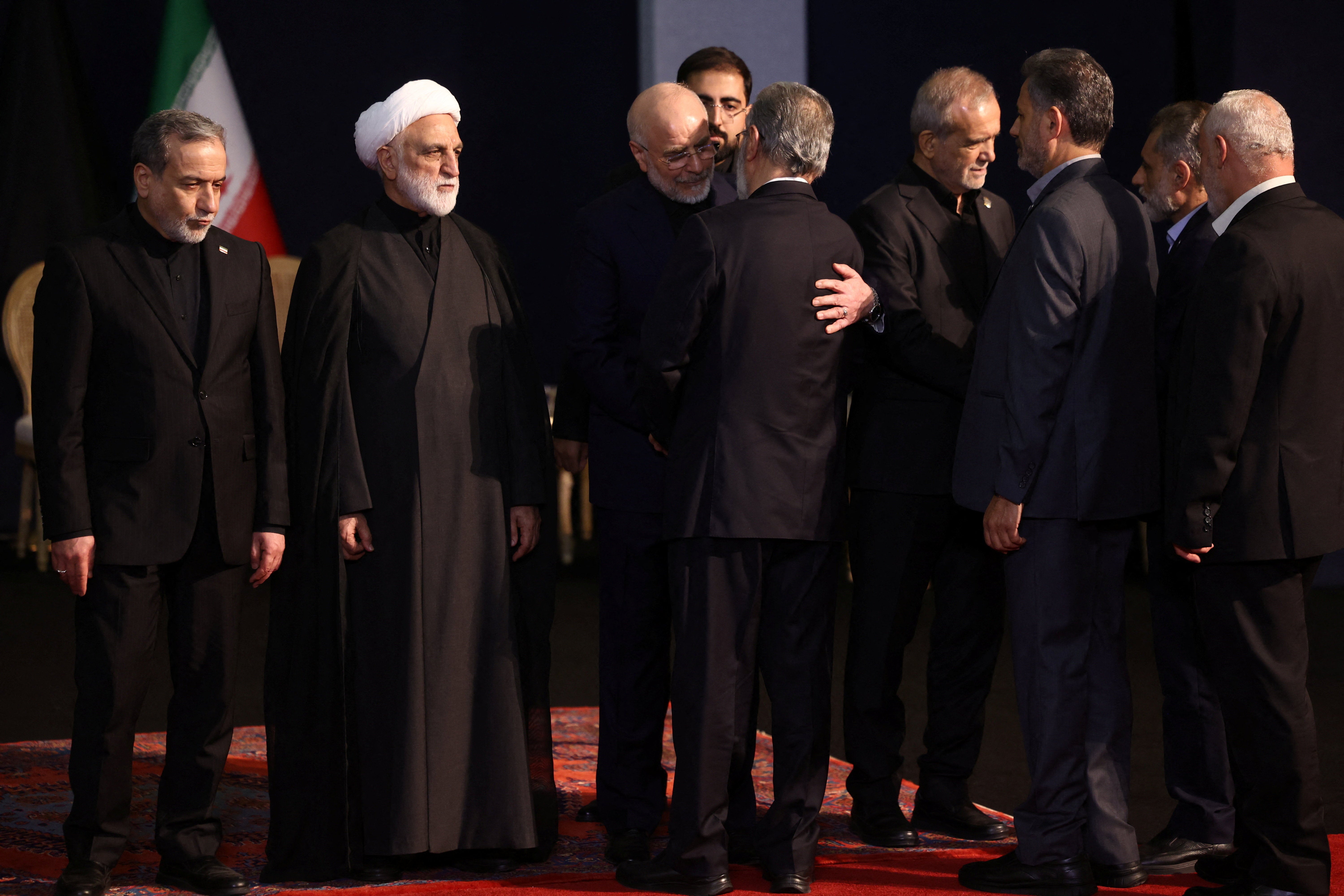 Iranian Parliament Speaker Mohammad Baqer Qalibaf embraces Ziyad al-Nakhalah, Secretary-General of Palestinian Islamic Jihad as they attend a farewell ceremony for Iran's late Supreme Leader Ayatollah Ali Khamenei