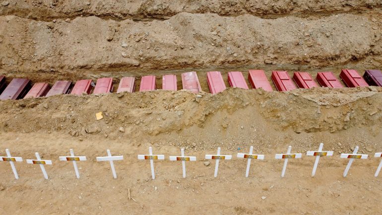 A drone view of coffins on the day of the burial of earthquake victims, in the aftermath of the June 24 earthquakes, at La Esperanza Cemetery, in La Guaira, Venezuela [Adriano Machado/Reuters]