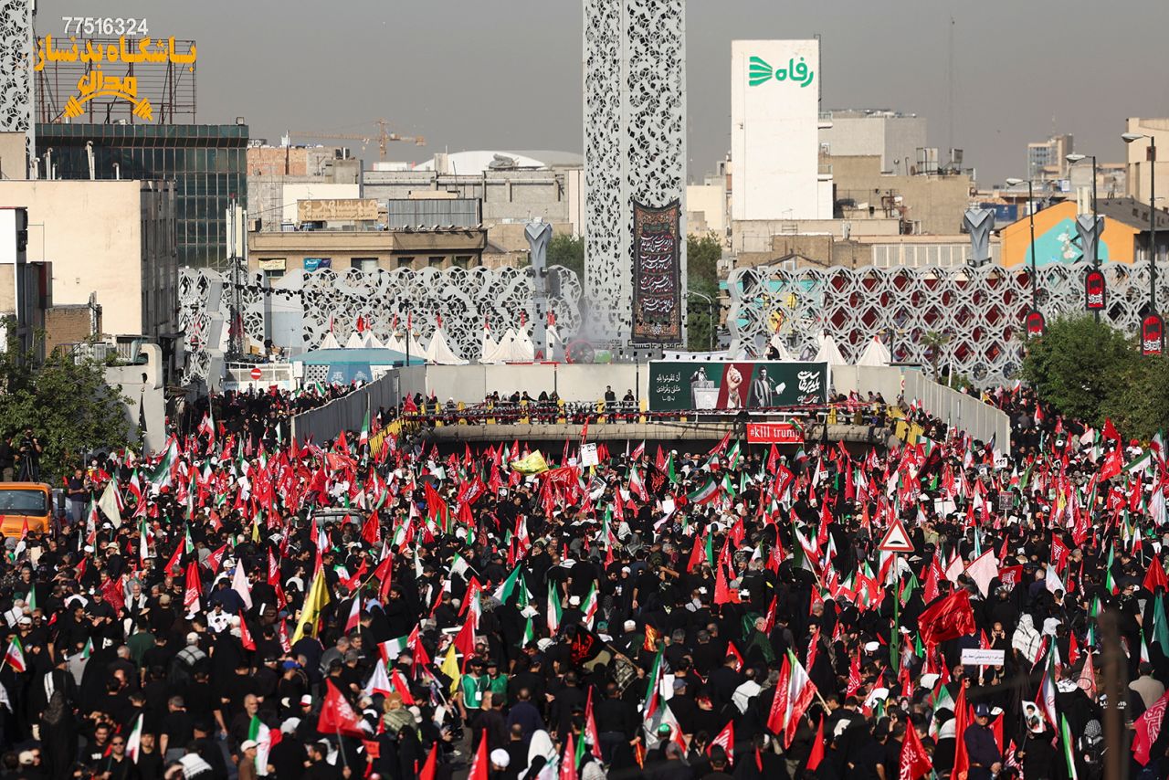 People gather on the day of a funeral procession for Iran's late Supreme Leader Ayatollah Ali Khamenei in Tehran, Iran, on Monday.