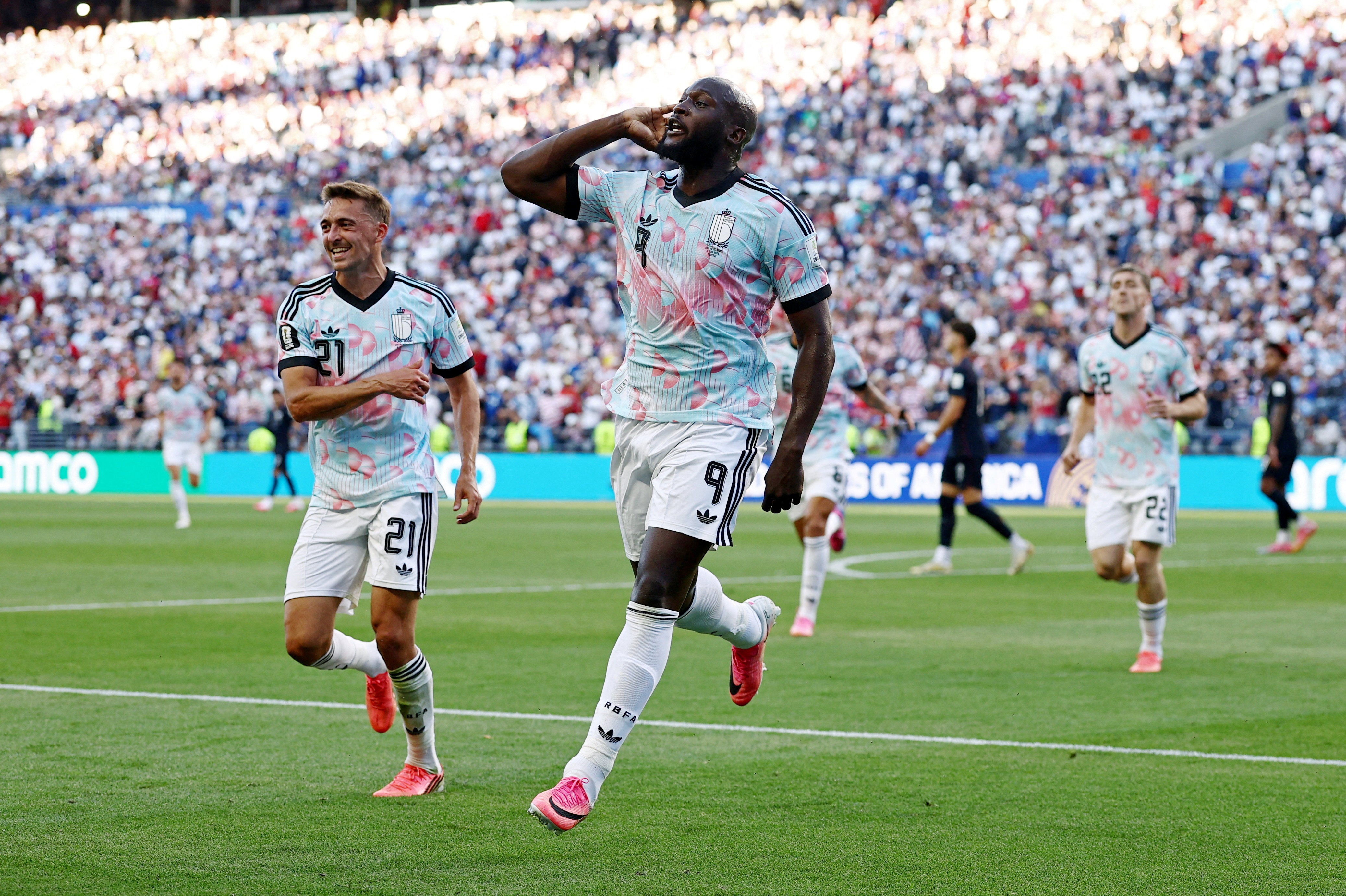 Belgium's Romelu Lukaku puts his hand to his ear to the USA fans after controversy surrounded their last-16 match