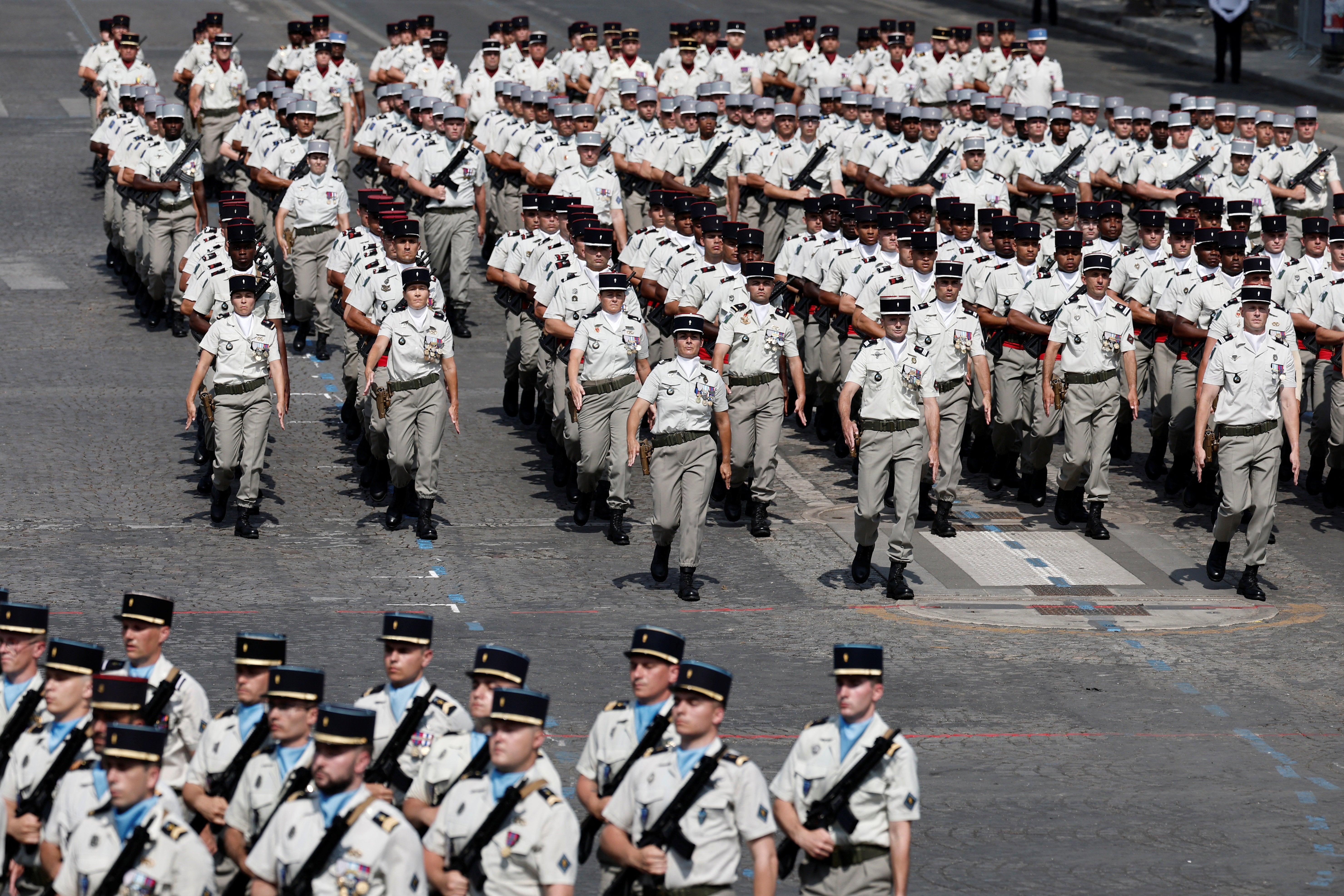 Soldiers from the 503rd Transport Regiment, specializing in force logistics, march during the annual Bastille Day military parade on the Champs-Elysees avenue in Paris