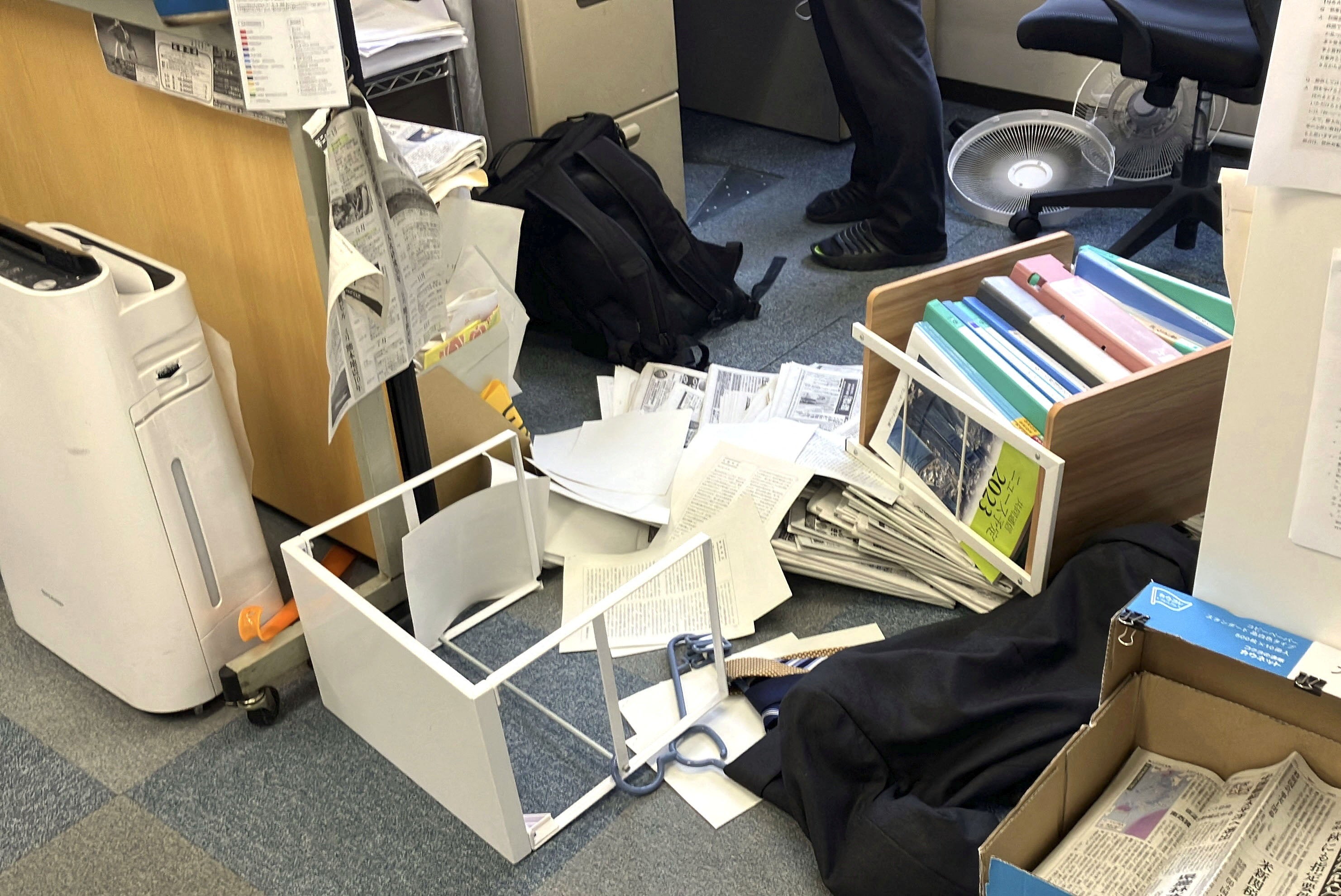 Toppled shelving after an earthquake, with a preliminary magnitude of 7.1, struck Japan's southern Kumamoto prefecture