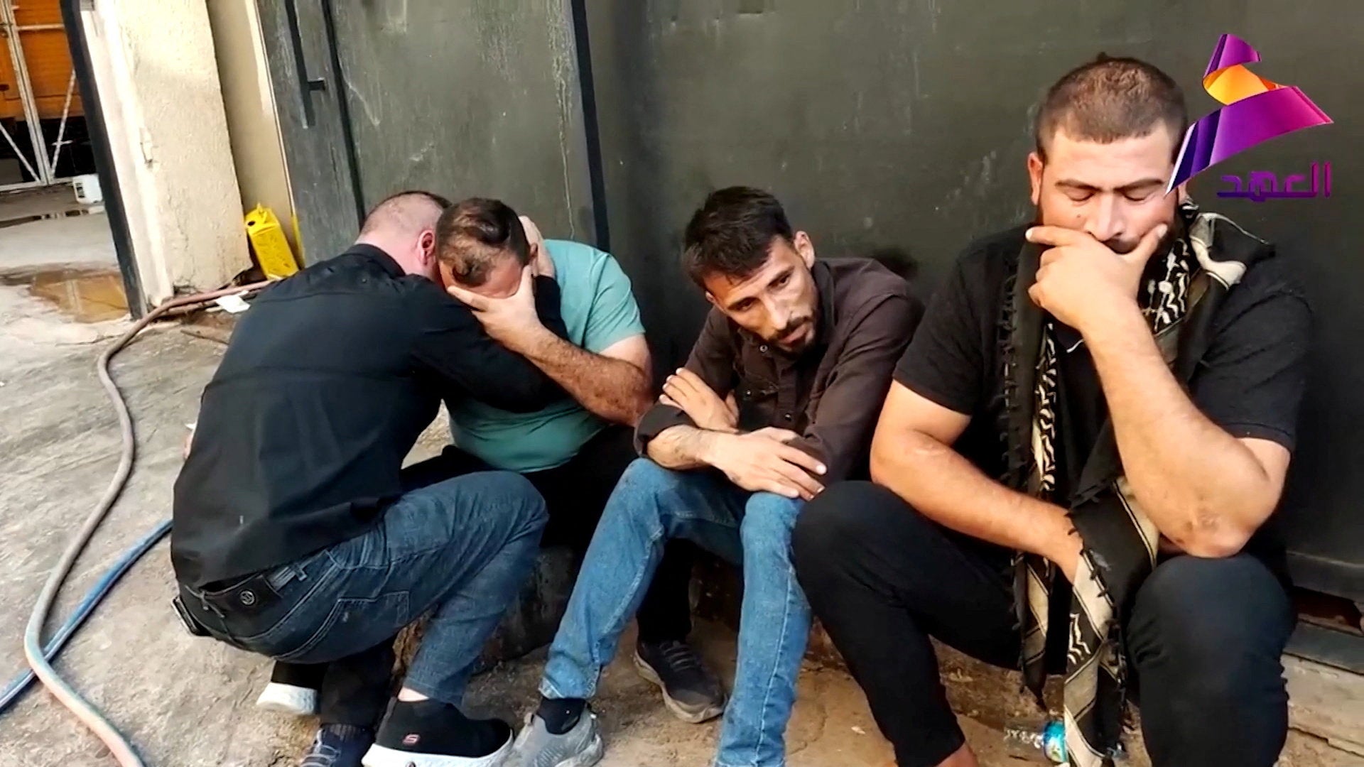 Men in Mosul mourn the death of members of Iraq’s Popular Mobilisation Forces