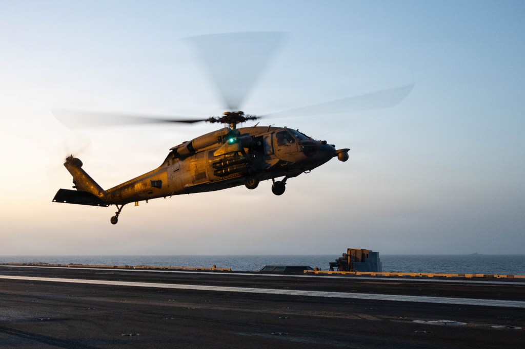 An MH-60S Sea Hawk, attached to Helicopter Sea Combat Squadron (HSC) 5, prepares to land aboard Nimitz-class aircraft carrier USS George H.W. Bush (CVN 77), May 12, 2026. USS George H.W. Bush is deployed to the U.S. 5th Fleet area of operations to support maritime security and stability in the Middle East. (U.S. Navy photo)
