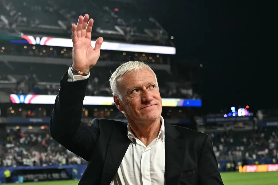 France manager Didier Deschamps waves to the crowd after their win over Iraq