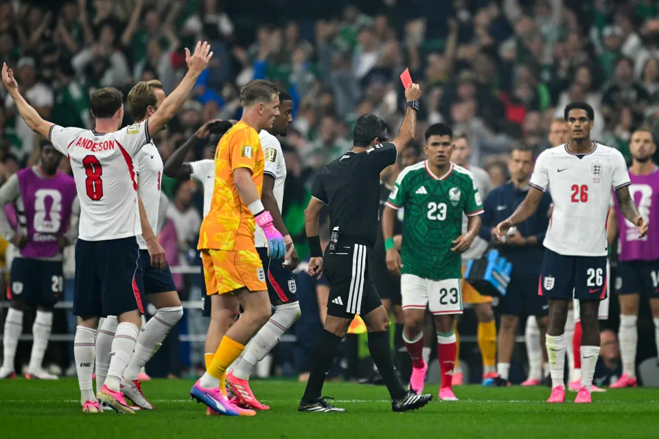 Jarell Quansah is shown a red card during England's match against Mexico