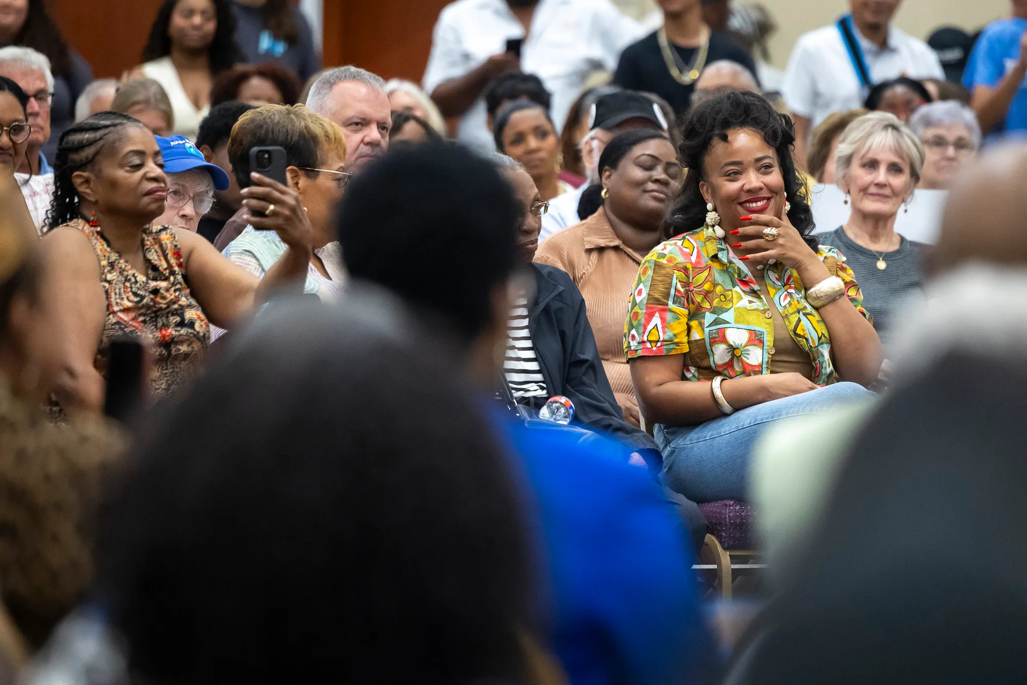 State Rep. Lauren Ashley Simmons, D-Houston, smiles as she listens during a town hall meeting hosted by James Talarico at Kingdom Builders Center on Sunday, July 19, 2026, in Houston.