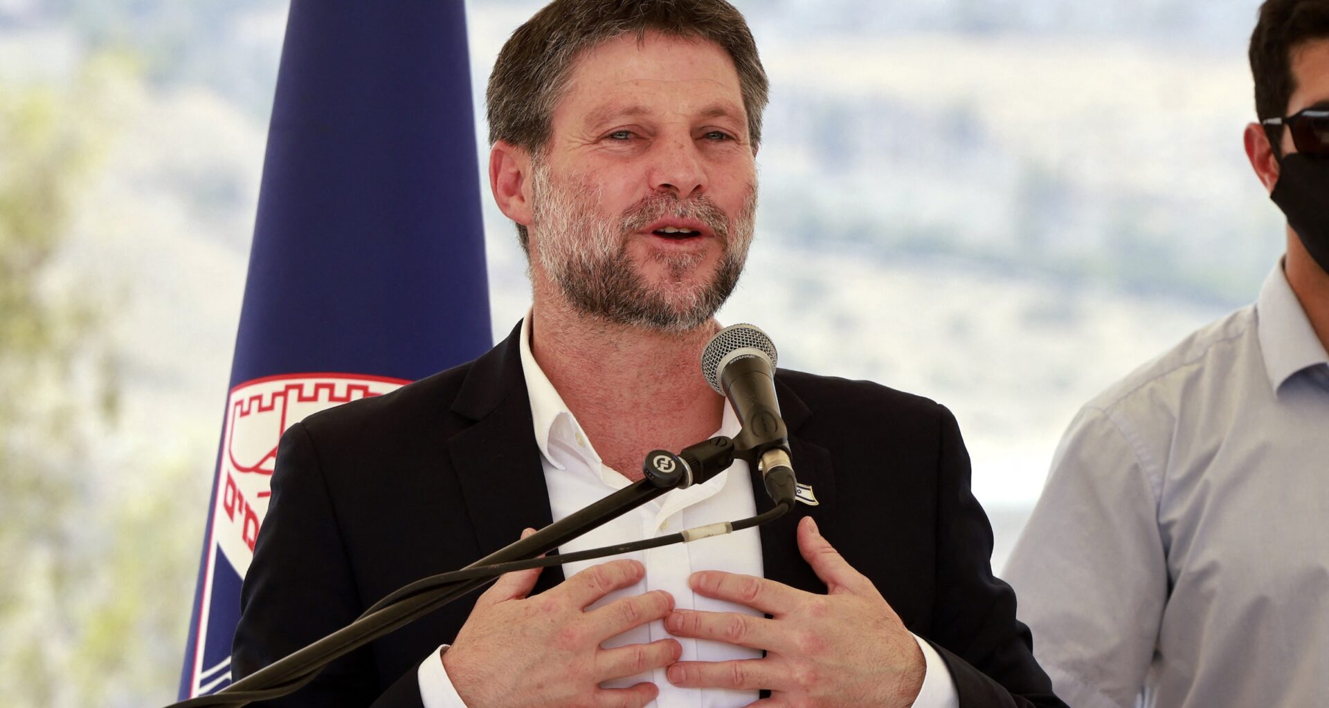 Israeli far-right Finance Minister Bezalel Smotrich speaks during a a press conference near the illegal settlement of Maale Adumim, outside Jerusalem in the occupied West Bank, on August 14, 2025.