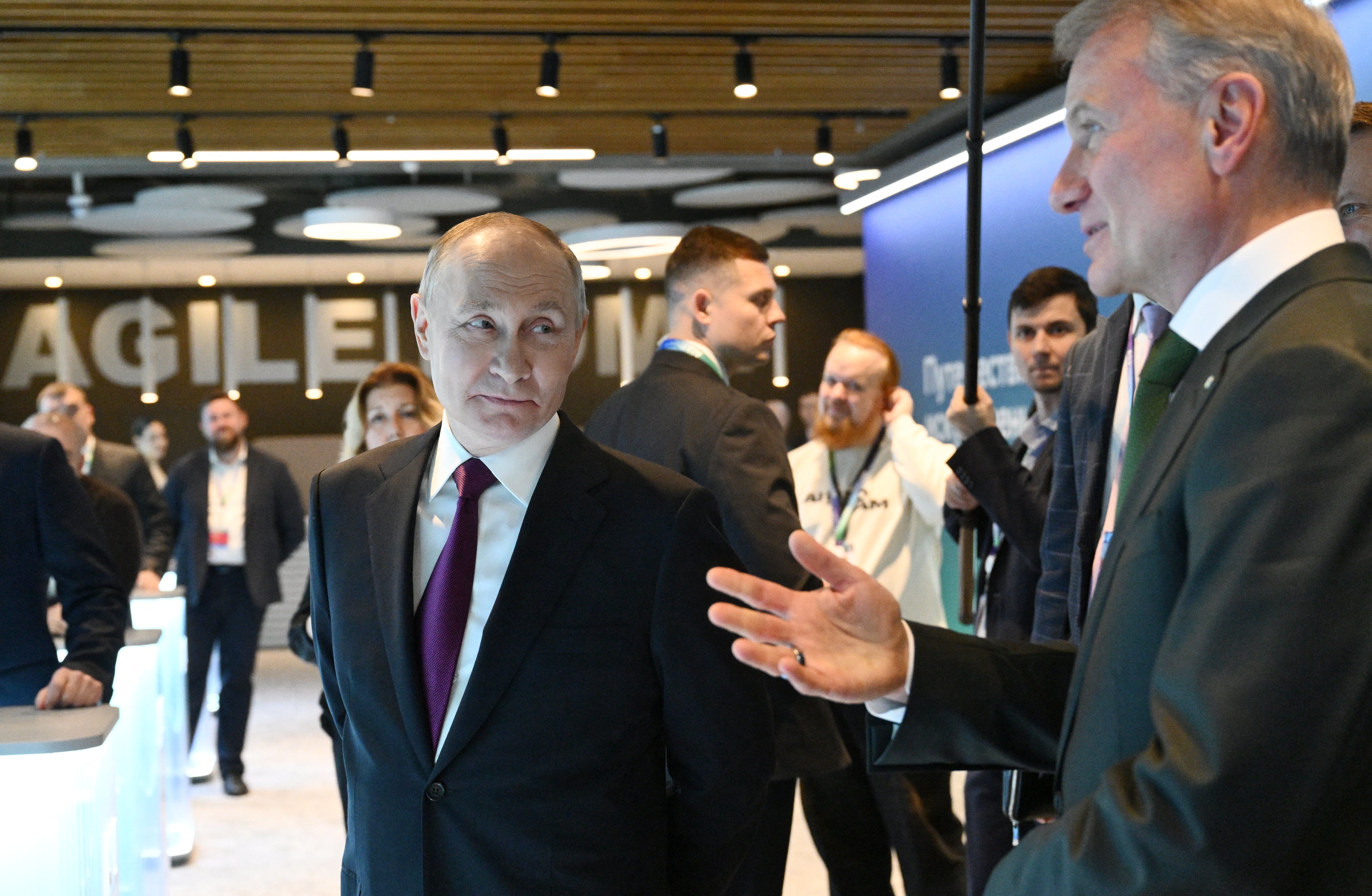 German Gref, right, pictured here with Putin, sounded eager for Russia to end hostilities – one of many influential people in the country growing weary of war