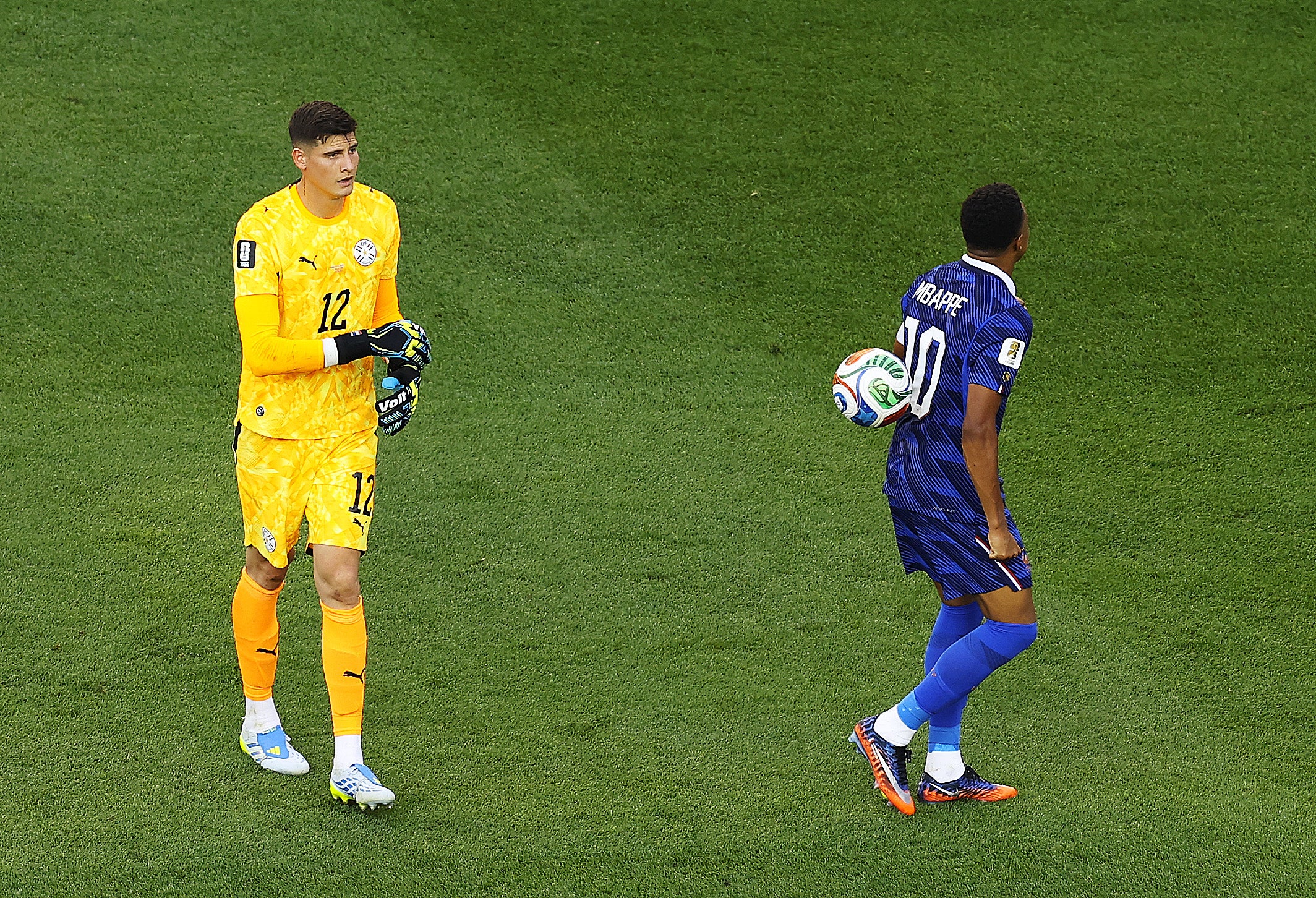 Paraguay keeper Orlando Gill threw the ball at Kylian Mbappe's back after the striker refused to shake hands with him