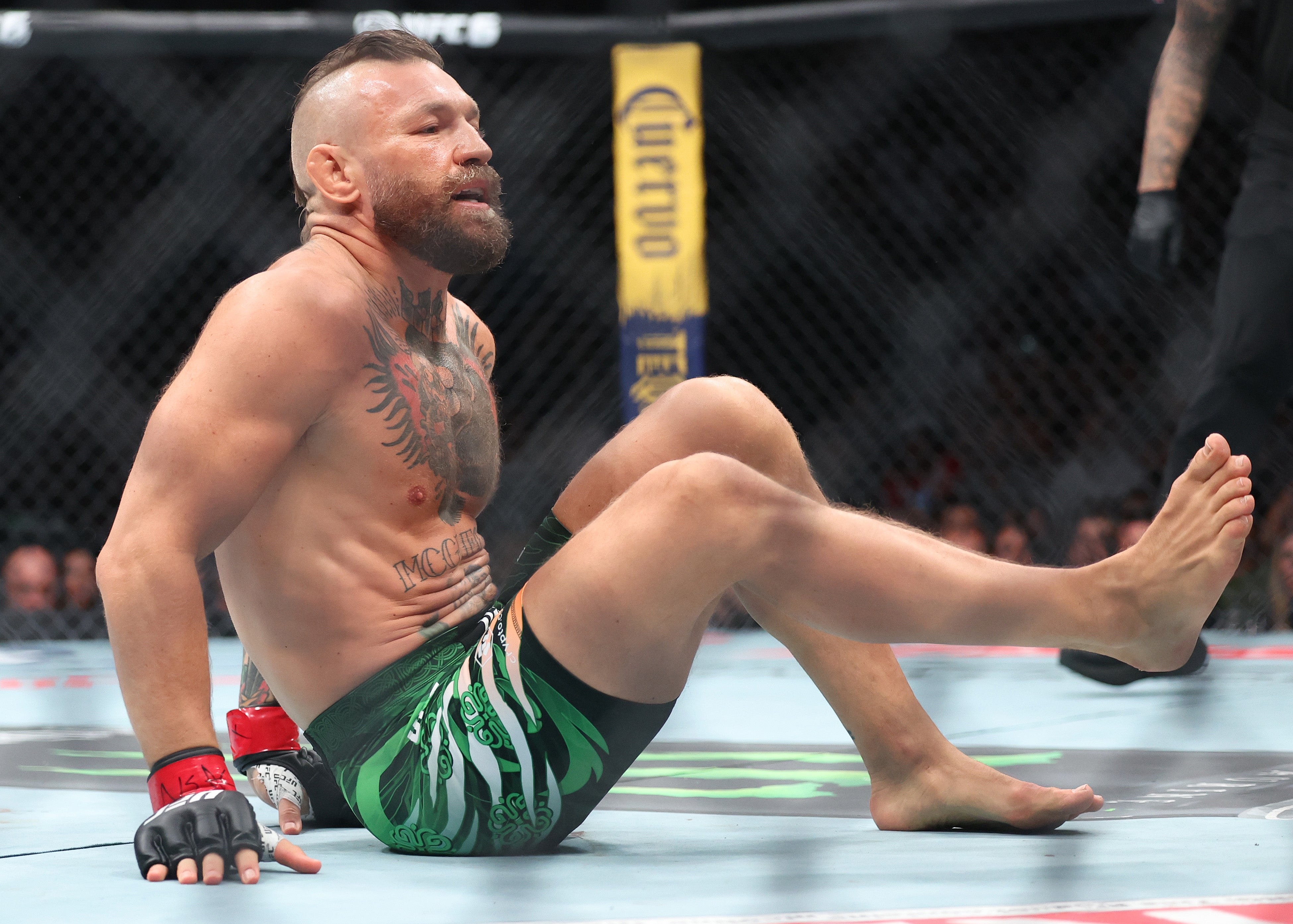 An injured Conor McGregor in the first round