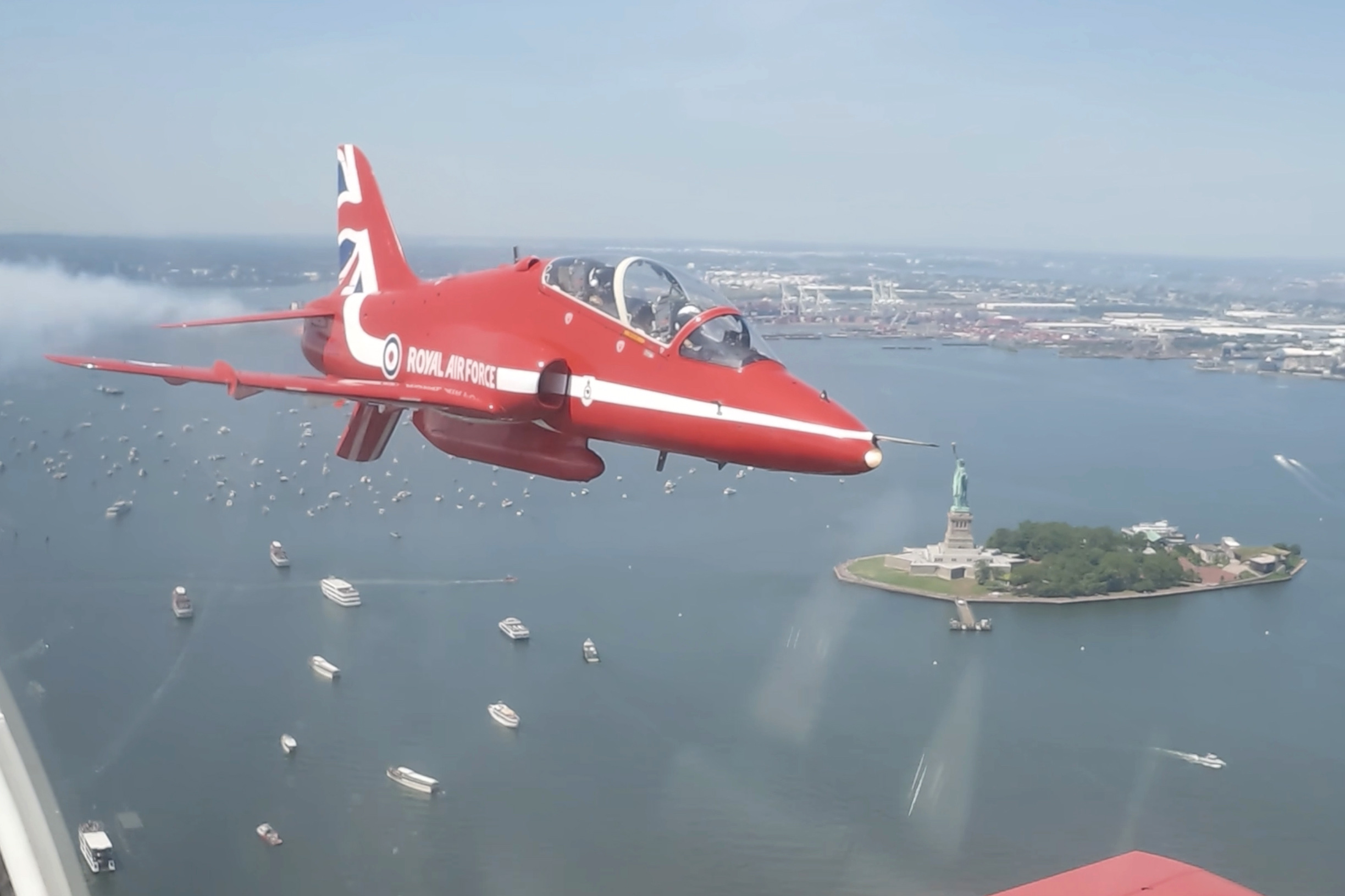 The British RAF aerobatic team, Red Arrows, performs a ceremonial flypast, NYC.