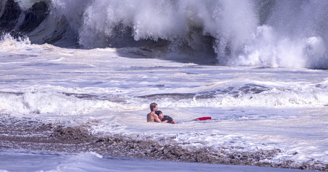 Teenage Lifeguard Fights Intense Waves to Bring Boy to Safety