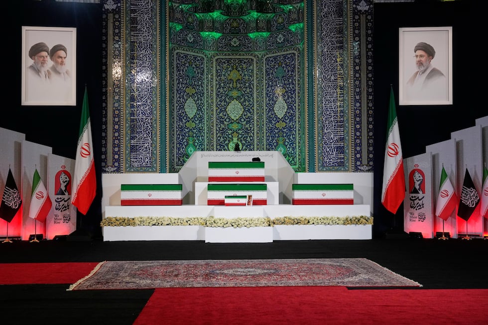 The coffins of slain Iranian Supreme Leader Ayatollah Ali Khamenei, center on top, and members...