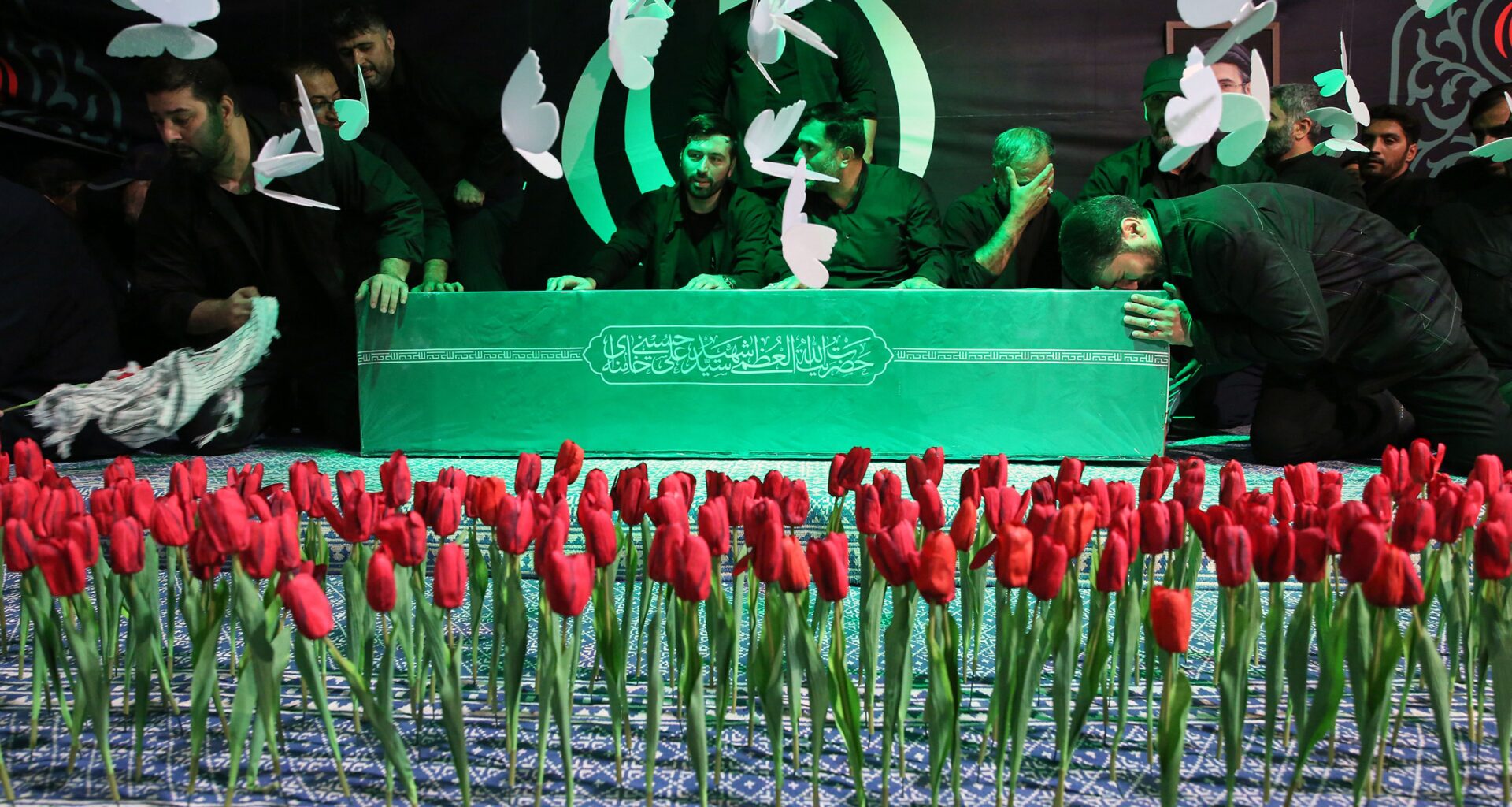In this photo released by Iran's Supreme Leader's office, mourners gather around the coffin of Iran's Supreme Leader Ayatollah Ali Khamenei as it lies in a mourning hall adjacent to the Imam Khomeini Hussainiya within the Supreme Leader's compound before his funeral in Tehran, Iran, late Thursday, July 2, 2026. (Office of the Iranian Supreme Leader via AP)