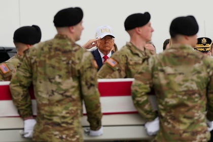 President Trump salutes at the coffin of a U.S. soldier killed in a drone strike at a command center in Kuwait, March. Credit: Julia Demaree Nikhinson/AP President Trump salutes at the coffin of a U.S. soldier killed in a drone strike at a command center in Kuwait, March.