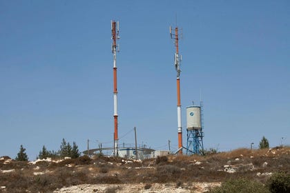 A cell tower in the Israeli settlement of Beit El in the central West Bank, in 2023. Credit: Emil Salman A cell tower in the Israeli settlement of Beit El in the central West Bank, in 2023.