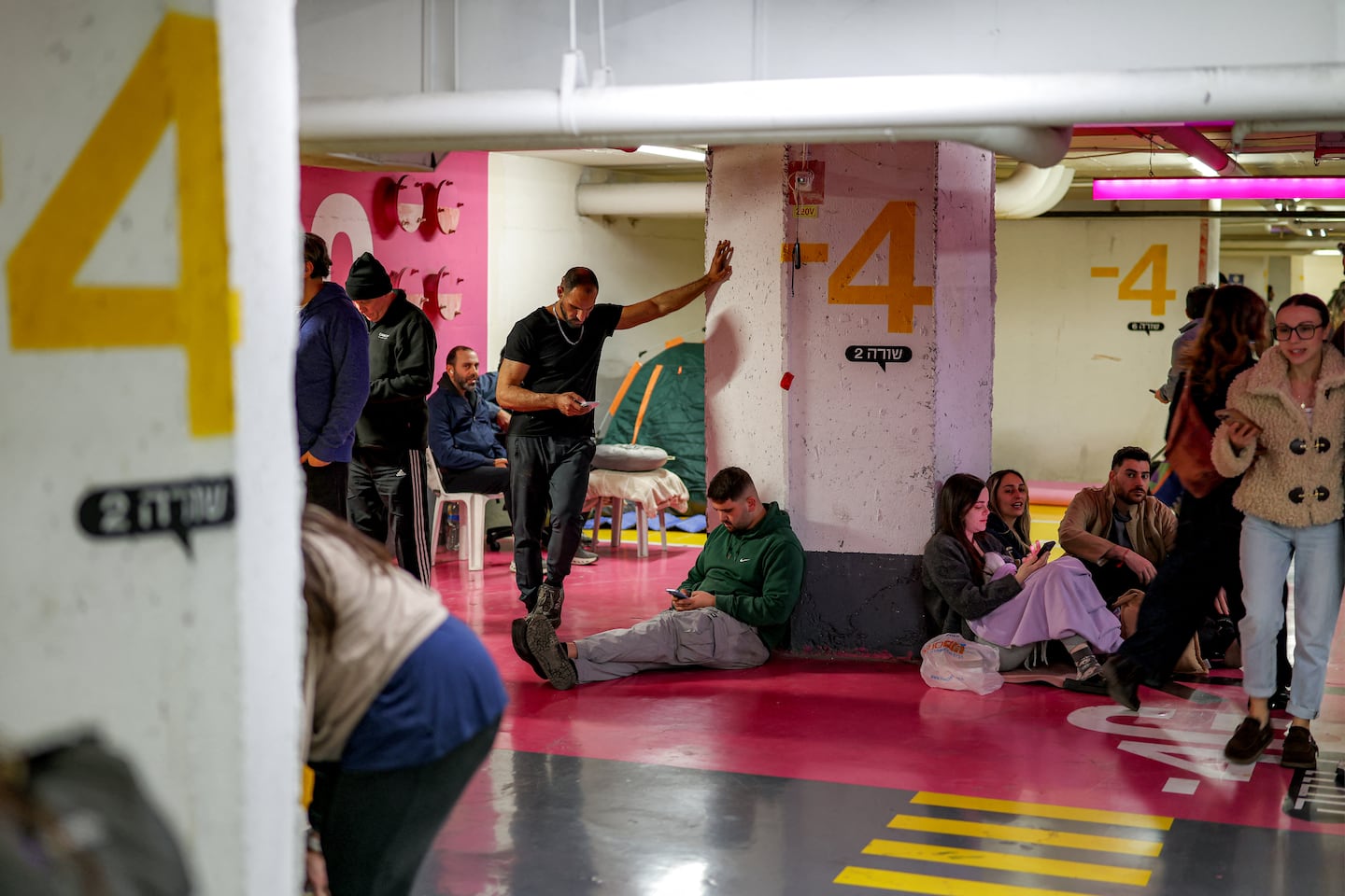 People took shelter in a parking garage after sirens wailed in Tel Aviv in March.