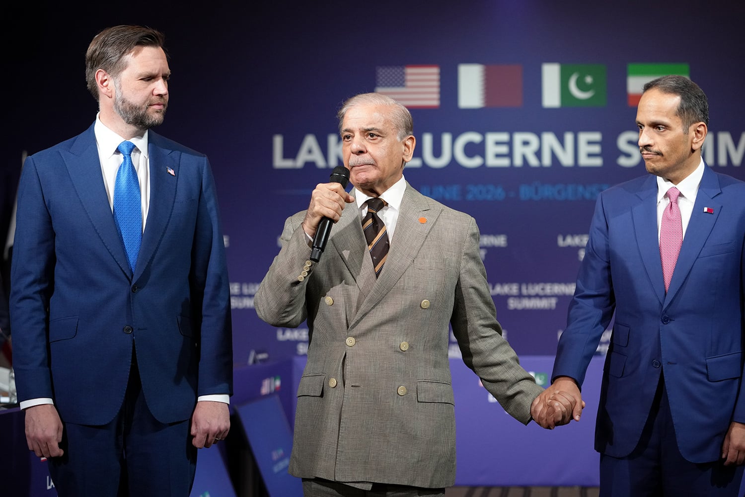 Pakistani Prime Minister Shehbaz Sharif speaks next to U.S. Vice President J.D. Vance, left, and Qatari Prime Minister Sheikh Mohammed bin Abdulrahman bin Jassim al-Thani, right, during a meeting between the United States, Iran, Pakistan, and Qatar in Stansstad, Switzerland.