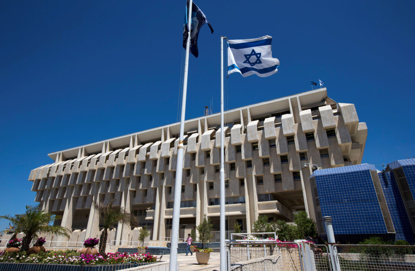 An Israeli flag flutters outside the Bank of Israel building in Jerusalem