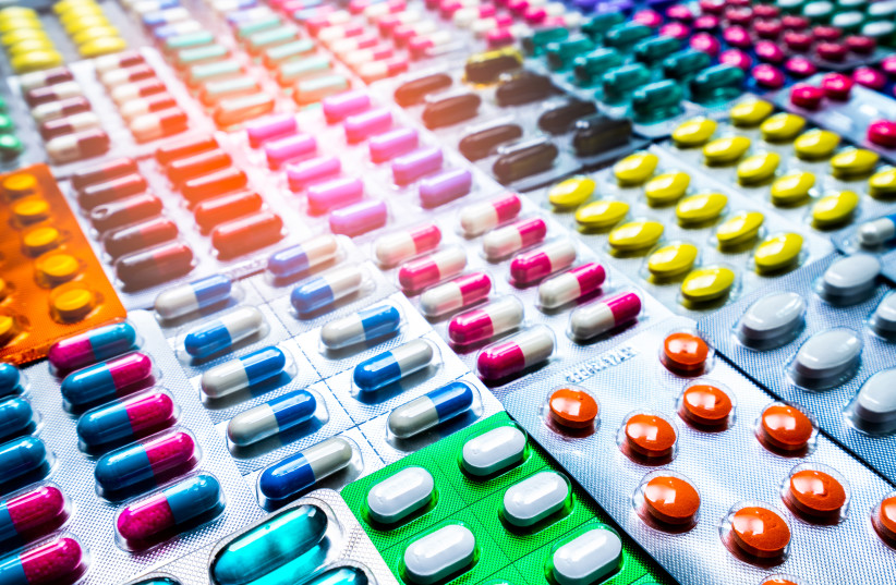 Colorful of tablets and capsules pill in blister packaging arranged with beautiful pattern with flare light. Pharmaceutical industry concept. Pharmacy drugstore. Antibiotic drug resistance