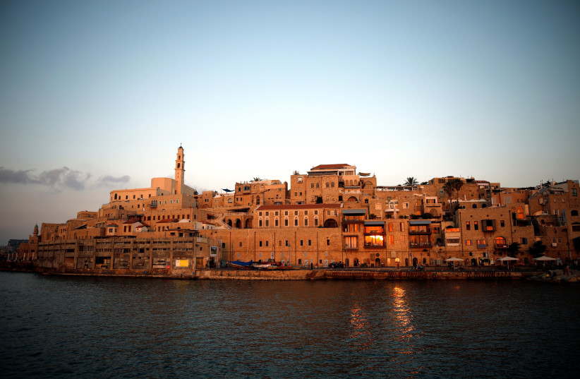 Lights are reflected in the Mediterranean Sea, as a view of Jaffa Port is seen at sunset, in Jaffa, Israel June 16, 2019. Picture taken June 16, 2019