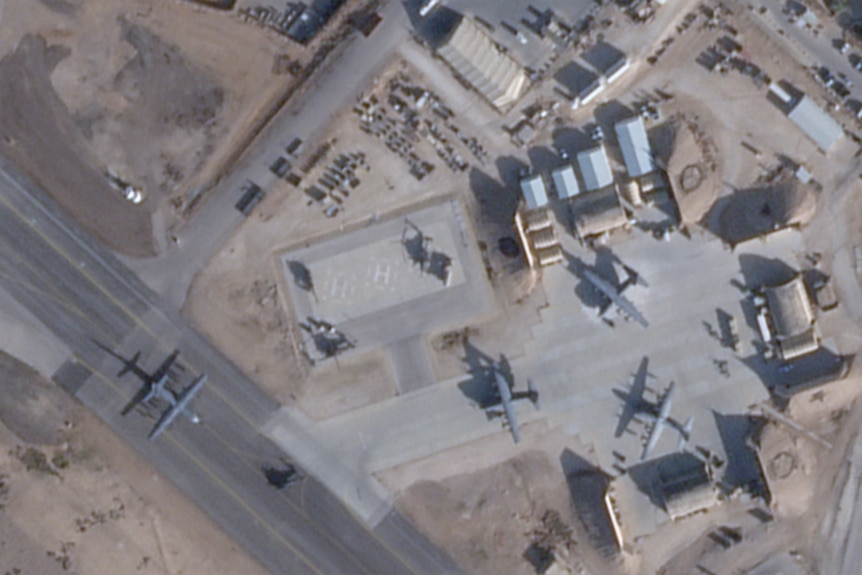 A satellite imagery of an air base with helicopters and planes.
