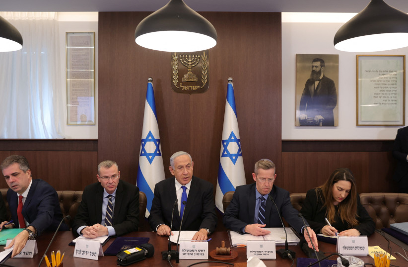 Israeli Prime Minister Benjamin Netanyahu, Justice Minister Yariv Levin, Foreign Minister Eli Cohen and cabinet secretary Yossi Fuchs attend the weekly cabinet meeting in the prime minister's office Jerusalem, February 19, 2023.