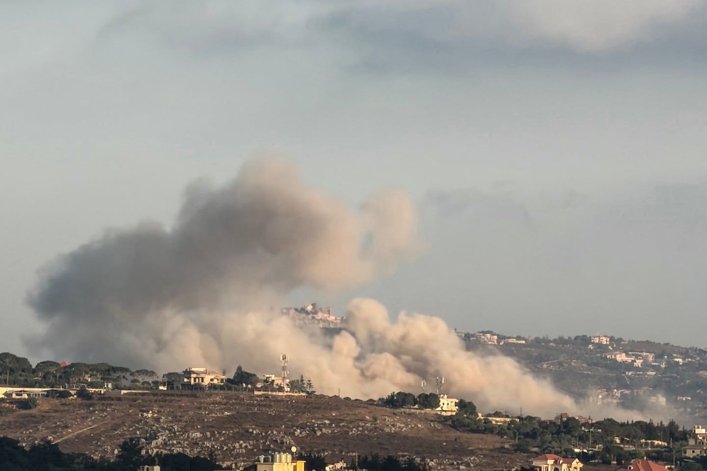 A photograph taken from the southern Lebanese city of Nabatieh shows smoke rising from the site of a controlled Israeli explosion in the village of Kfartibnit on July 17, 2026. Israel's defence minister told his US counterpart on July 16 that Israel is determined to keep its forces in "security zones" it has carved out inside Lebanon, Syria and the Gaza Strip. Lebanon and Israel, which have no formal relations, are engaged in talks to end hostilities after militant group Hezbollah drew Lebanon into the broader Middle East war by attacking Israel in March.