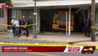 School bus crashes into Parkville building, 3 taken to hospitals