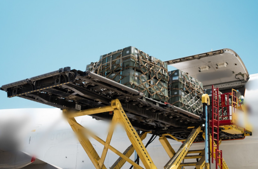 Unloading a cargo plane carrying military equipment from US and Germany to defend Israel from Iranian attacks, June 19, 2025.