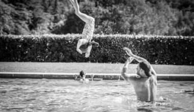 Prince Harry throws daughter Lilibet in swimming pool in newly released family holiday photos