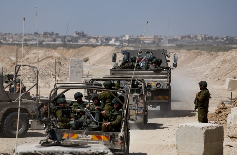 Israeli soldiers enter Gaza at the border as seen from Israel, October 3, 2025