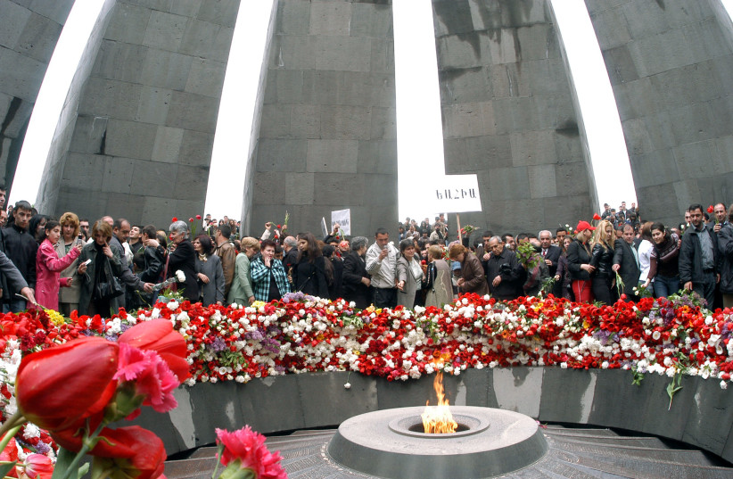 People gather at a memorial site to commemorate the dead in the 1915 mass killing of Armenians, in Yerevan, 2006