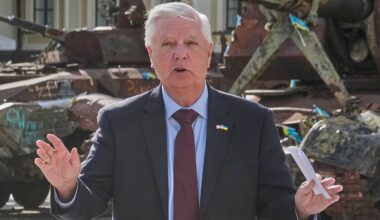 US Sen. Lindsey Graham, R-S.C. answers a question from a media member near damaged Russian vehicles on display in central Kyiv, Ukraine, on July 10, 2026.